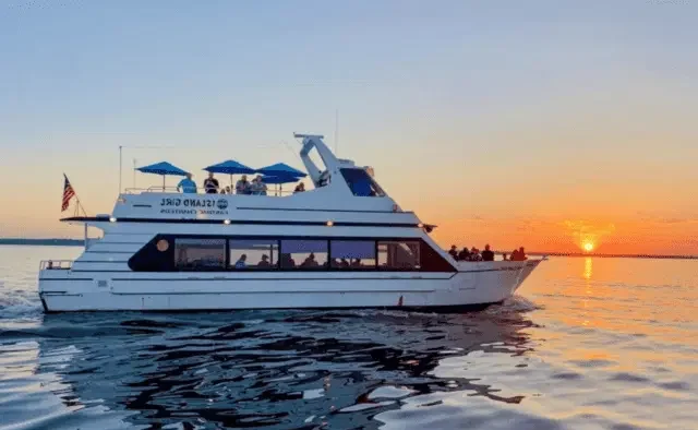 Luxury yacht with guests enjoying the best sunset cruise in Goa by Goa Tourist Taxi